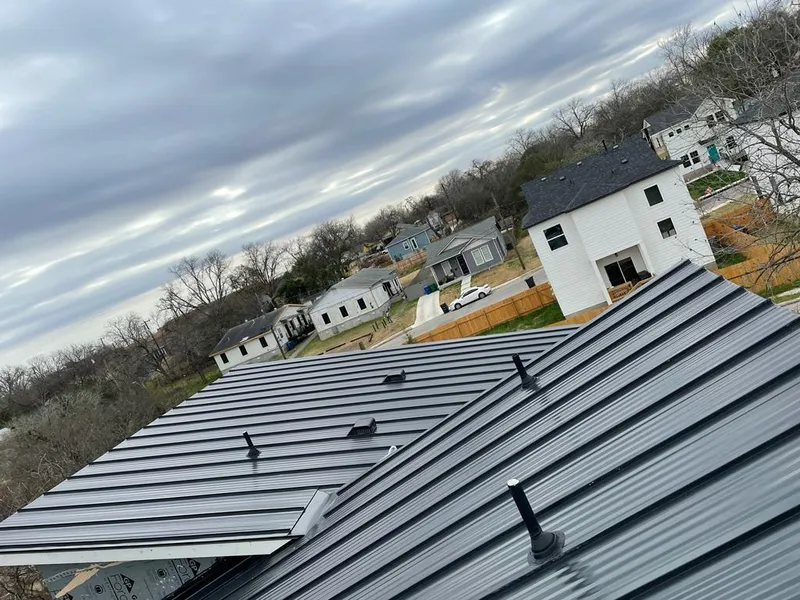 Standing seam metal roof panels with vents for Skylight Repair in Alvin